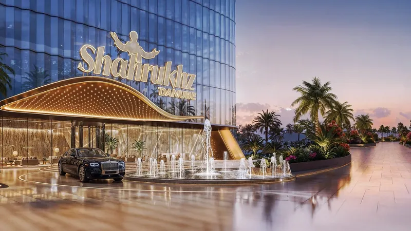 Arrival court at Shahrukhz with signage above a covered drop-off and water features