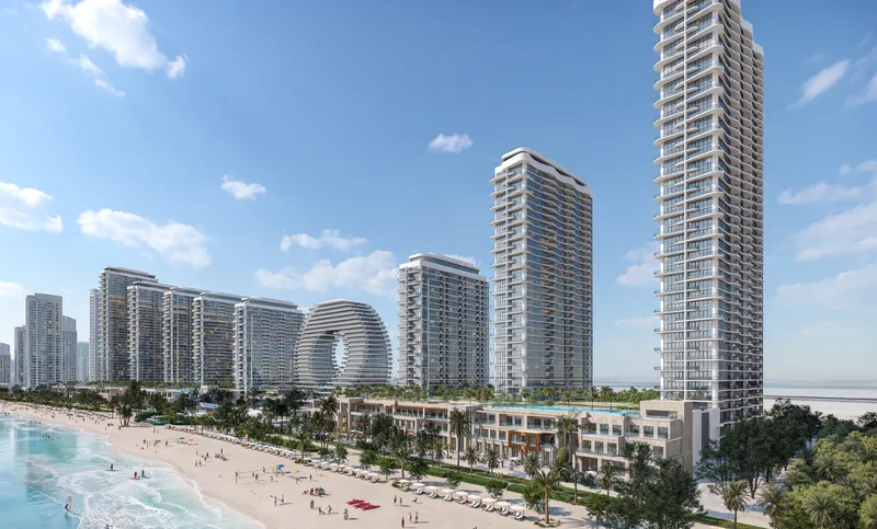 Sobha Aquamont towers rising behind the beach on North Beach, Downtown Umm Al Quwain