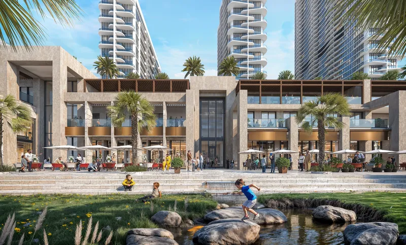 Retail and dining terraces with a stream and play area at the foot of the Sobha Aquamont towers