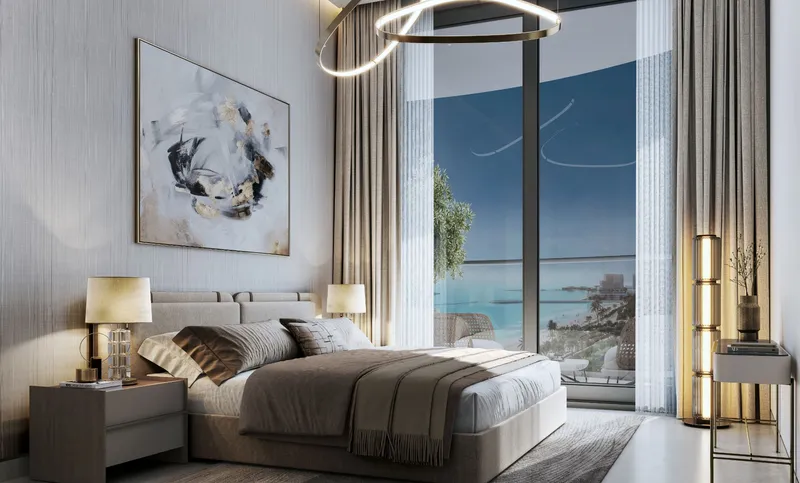 Sobha Aquamont bedroom with floor-to-ceiling glazing and a sea view
