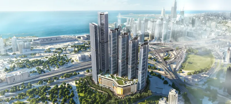 Aerial render of Sobha Central towers and podium on Sheikh Zayed Road with the Dubai Marina and JLT skyline and the sea behind