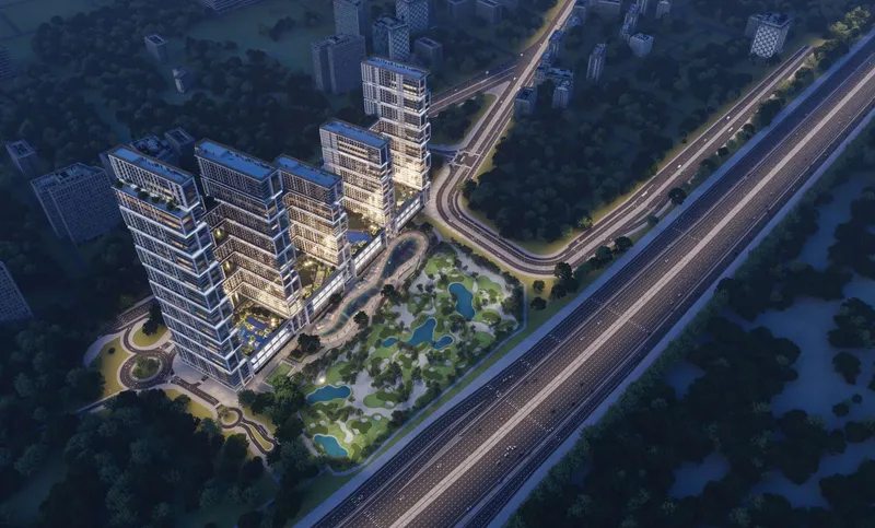 Night aerial render of the Sobha One towers, courtyards and Ras Al Khor Road
