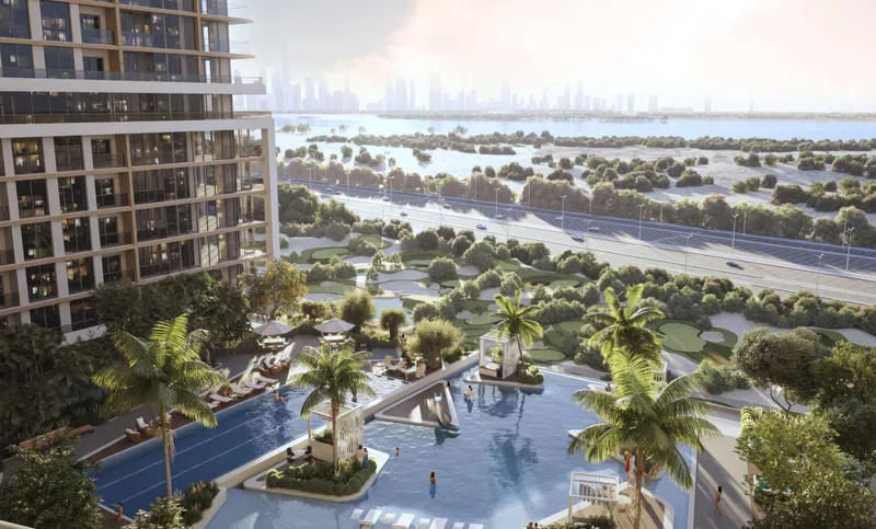 Sobha One podium pool and gardens with Ras Al Khor and the city skyline beyond