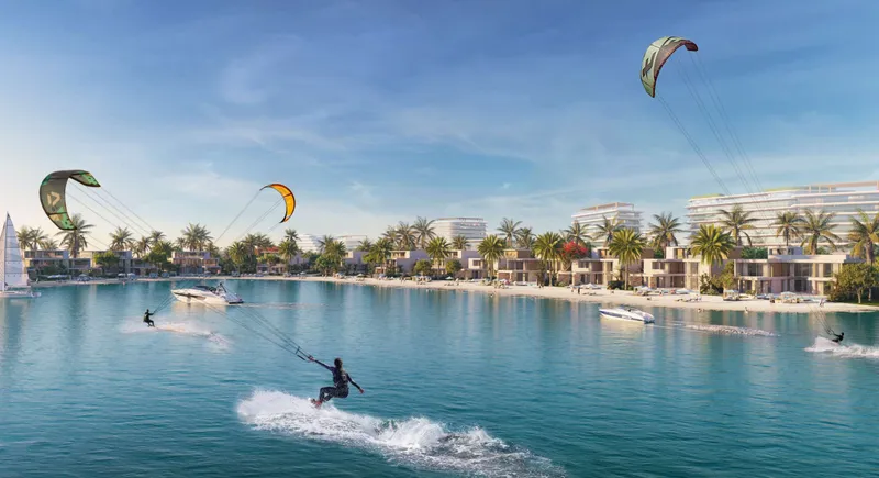 Render of beachfront villas on the Siniya Island lagoon with kitesurfers and a jet ski