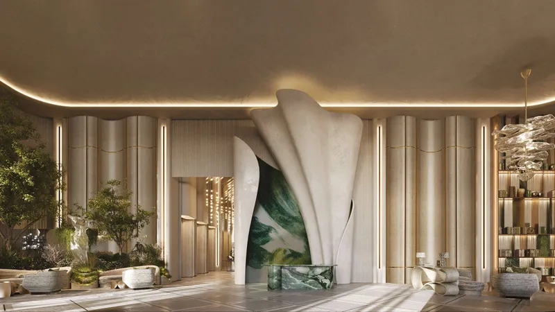 Double-height lobby at Sofitel Residences Dubai City View with a sculptural centrepiece and planting