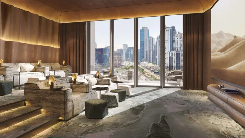 Residents’ lounge with sofas and floor-to-ceiling windows looking over Downtown Dubai