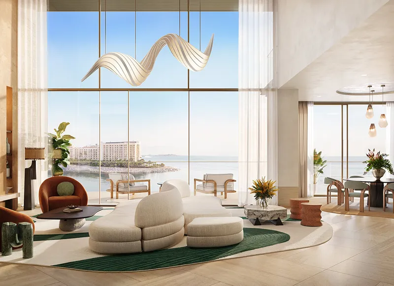 Open plan living area of a four bedroom duplex at Solaya with floor to ceiling windows and sea and city views