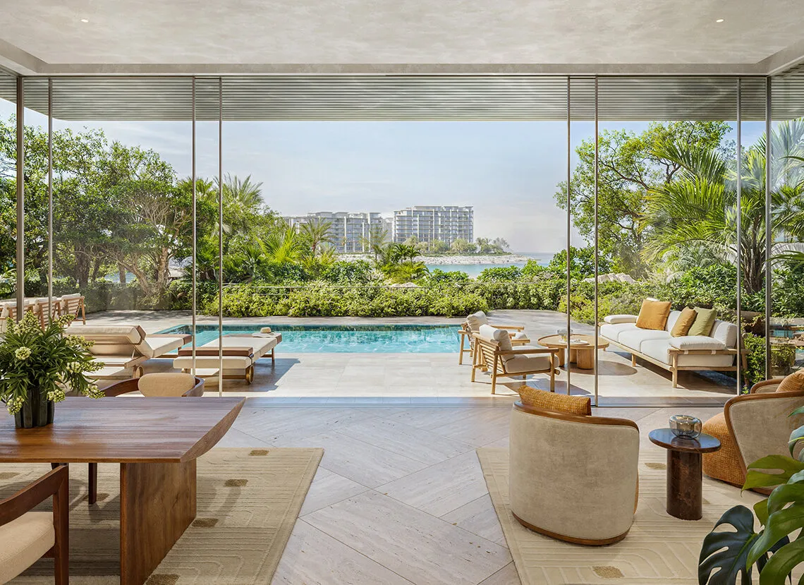 Private pool and courtyard garden of a ground floor three bedroom garden residence at Solaya, with the sea beyond