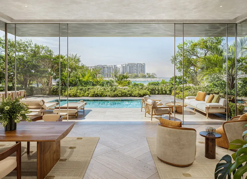 Private pool and courtyard garden of a ground floor three bedroom garden residence at Solaya, with the sea beyond