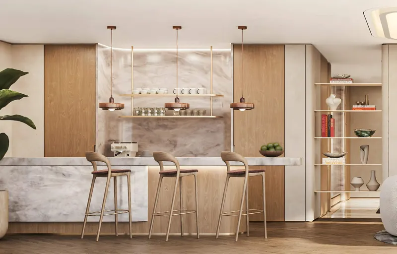 Cafe counter at SOMA Residences in marble and pale timber with bar stools