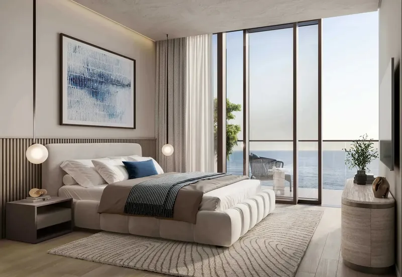 Bedroom with full-height glazing and a sea view at Soulever by BEYOND