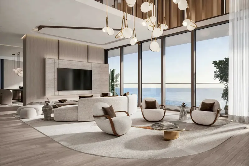 Double-height living room with sea views at Soulever