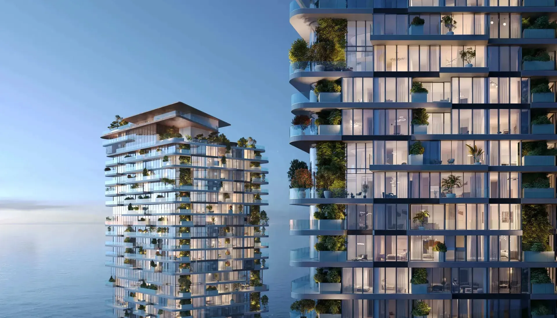 The two Soulever towers with planted balconies against the sea, Dubai Maritime City