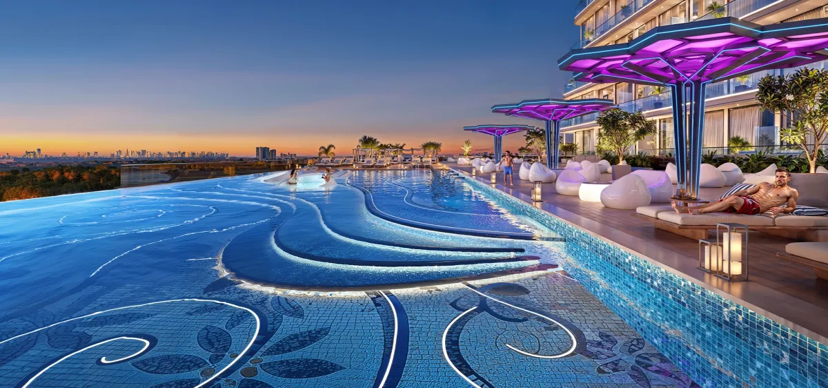 Infinity pool on the Sparklz by Danube podium with mosaic detailing at sunset