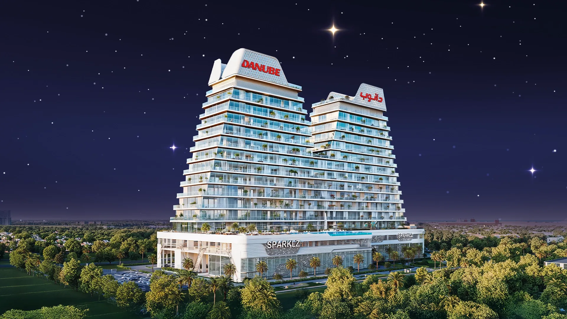 Sparklz by Danube, twin stepped towers at night in Al Furjan, Dubai