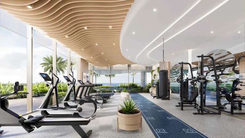 Double-height gym at Sunset Bay Grand by Imtiaz