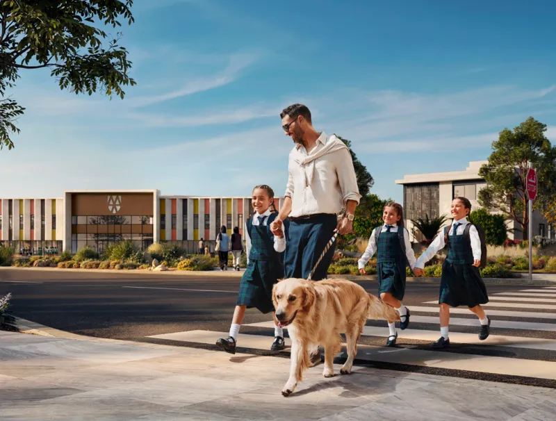 A family walking to school at Marsa Al Saadiyat