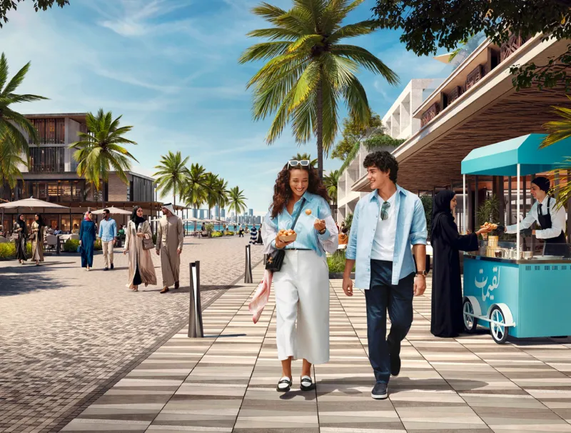 Waterfront promenade with cafés and retail at Marsa Al Saadiyat