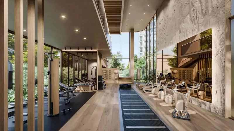 Indoor gym with floor-to-ceiling glazing at Talea
