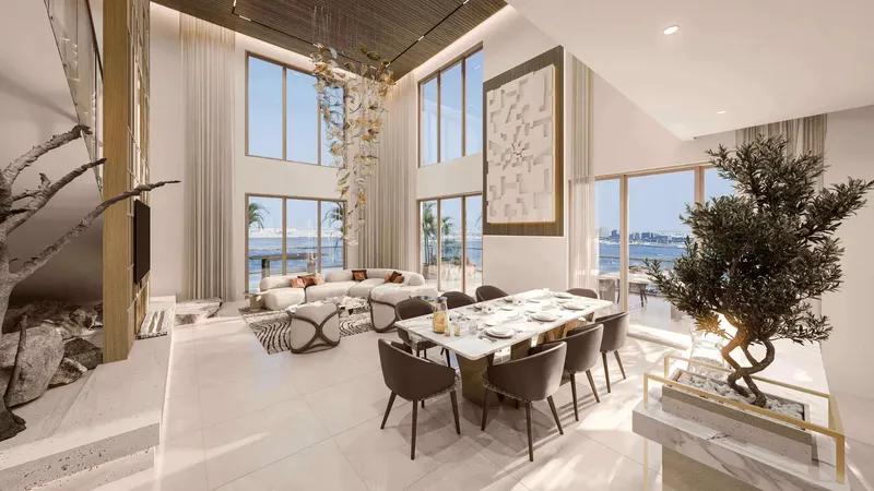 Double-height living and dining room with sea views at Talea