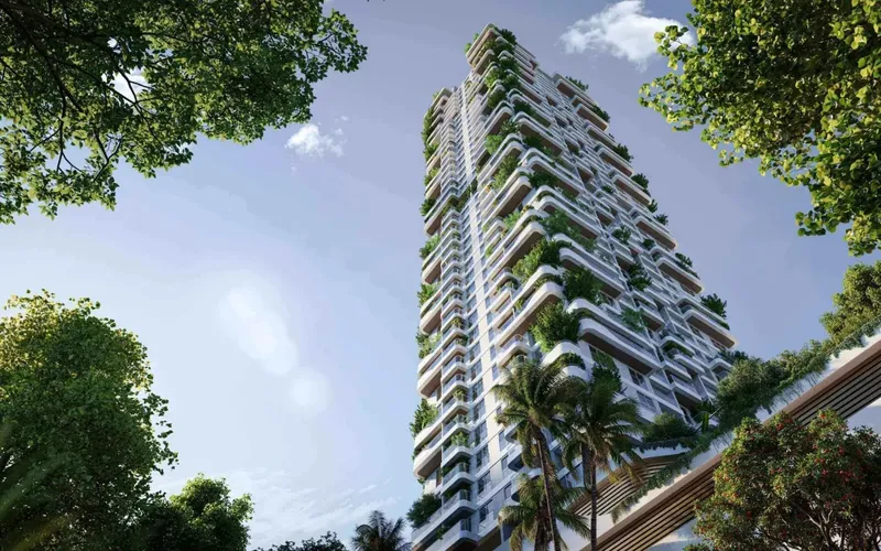 Talea tower rising above the planned forest landscape in Dubai Maritime City