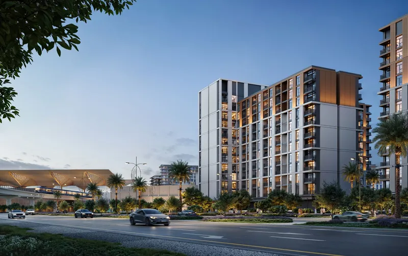 Render of a mid-rise Terra Woods apartment building at dusk beside a landscaped road