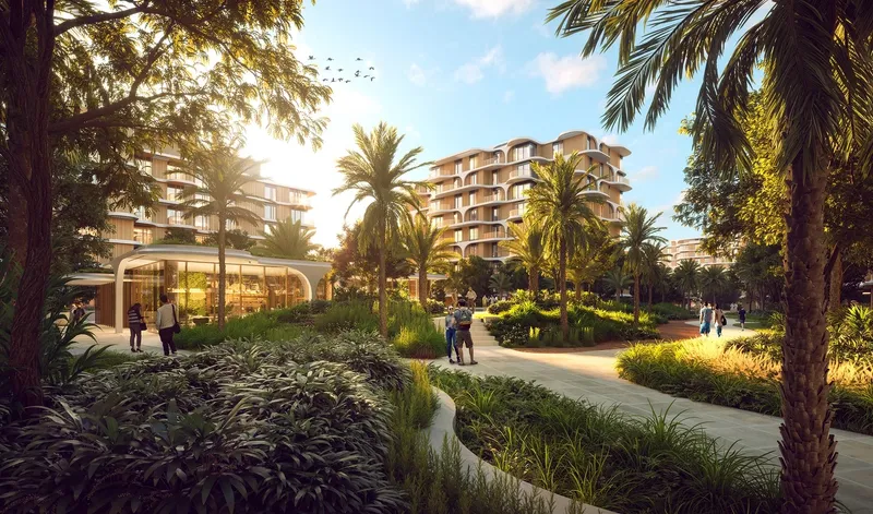 Render of a shaded garden path at The Beach House with a glass pavilion and residential buildings behind