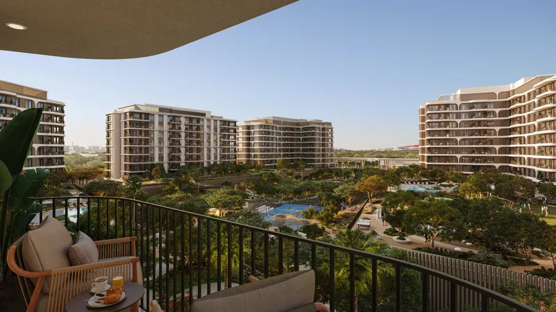 View from an apartment balcony at The Canopies over the landscaped park, pools and neighbouring buildings