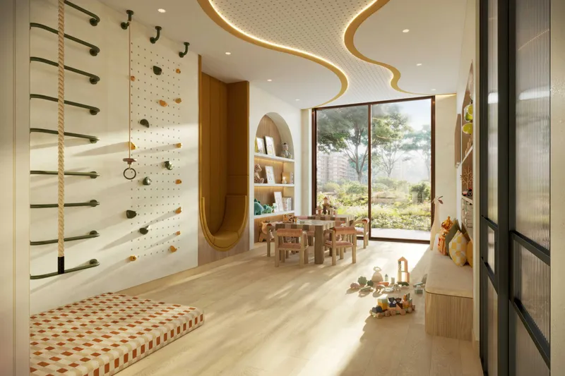 Children's playroom at The Canopies with a climbing wall, play table and garden view