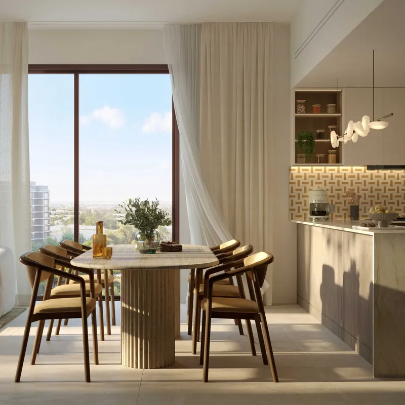 Apartment dining area and kitchen at The Canopies with a round table by a full-height window