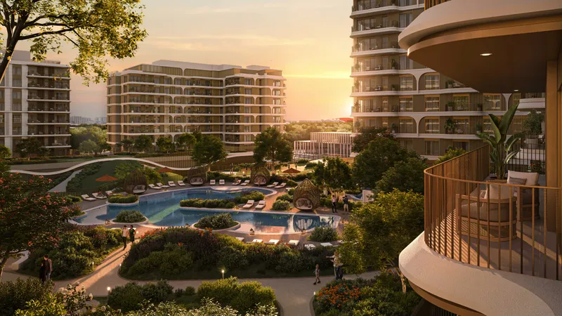 Render of The Canopies at Yas Point at sunset: mid-rise apartment buildings around a landscaped park and pool