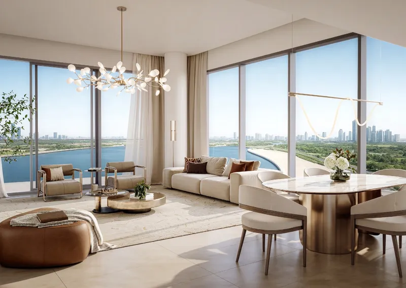 Render of a two-bedroom living and dining room at The Edit at d3 with floor-to-ceiling windows over the water