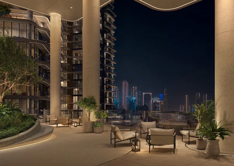 Render of the sky garden lounge at The Edit at d3 at night, with lounge seating and planting between the towers