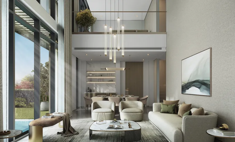 Double-height living and dining room with a gallery above and garden views in an Orchard villa