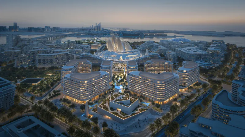 Aerial render of The Row Saadiyat's mid-rise buildings around the Zayed National Museum at dusk, with Saadiyat Island and the coast beyond