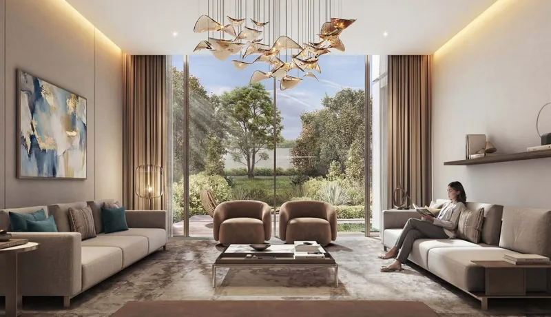 Render of a villa living room at The Terraces with sofas, a sculptural chandelier and tall windows onto the garden