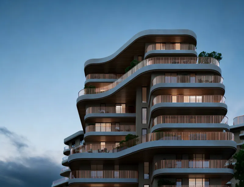 Render of a The Wilds Residences building at dusk with layered curved balconies and timber screens