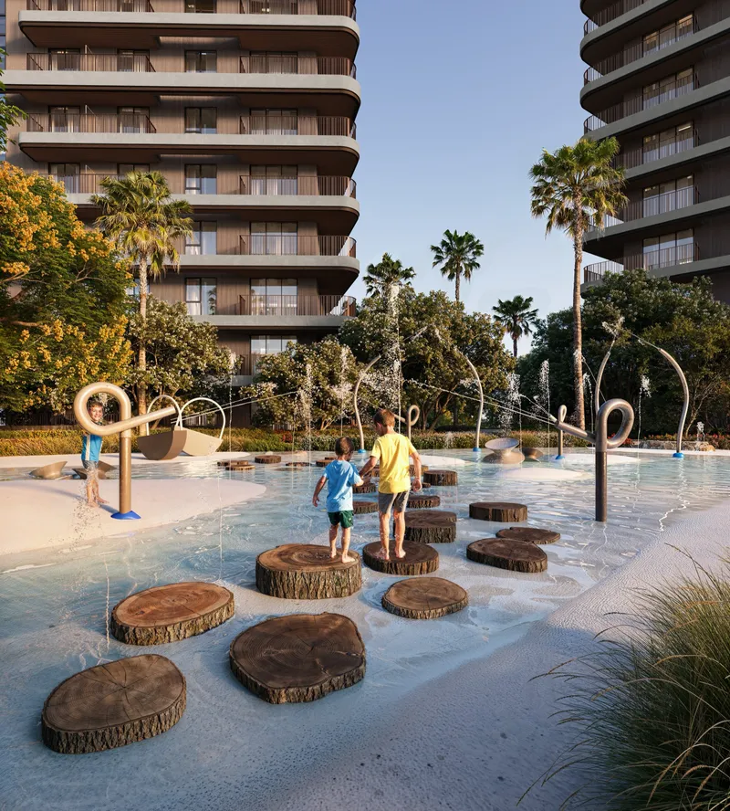 Render of children playing at a splash pad with timber stepping stones below The Wilds Residences buildings