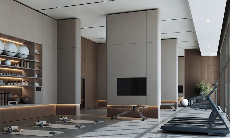 Residents' fitness centre with treadmills and a stretching area at Tranquil Beach Residences