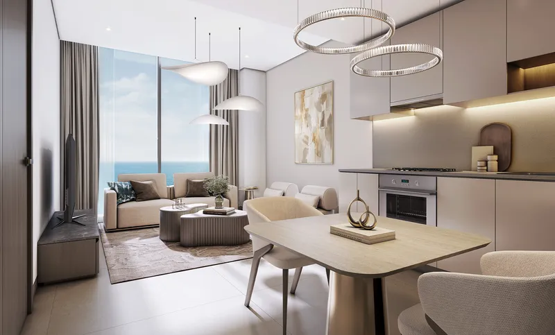 Living room, dining table and open kitchen with a sea view at Tranquil Beach Residences