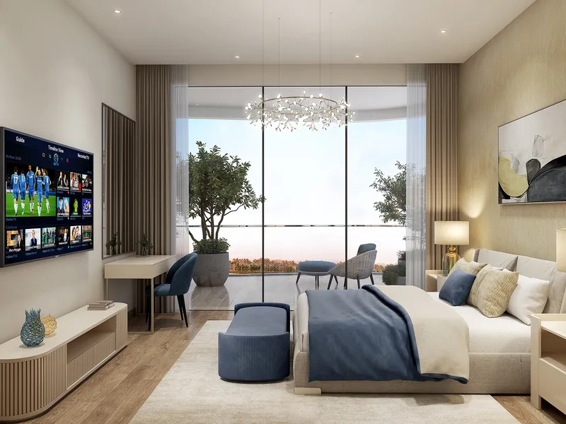 Bedroom in a Valencia apartment with a double bed, desk and glazing to a planted balcony