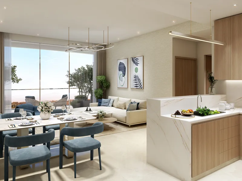 Open-plan kitchen and dining area in a Valencia apartment with a marble island and timber cabinets