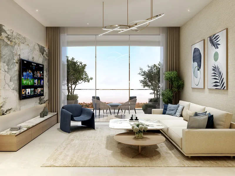 Living room of a Valencia apartment with a sofa, marble TV wall and full-height glazing to a balcony