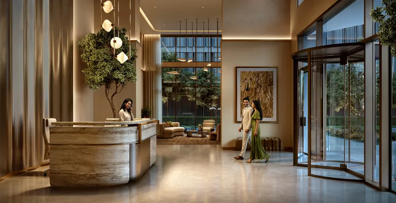 Interior render of the high-ceiling Valia lobby with a stone reception desk
