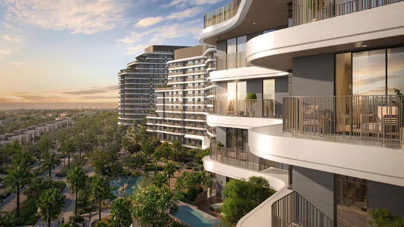 Render of a Verdes by Haven balcony looking over gardens and neighbouring buildings at sunset