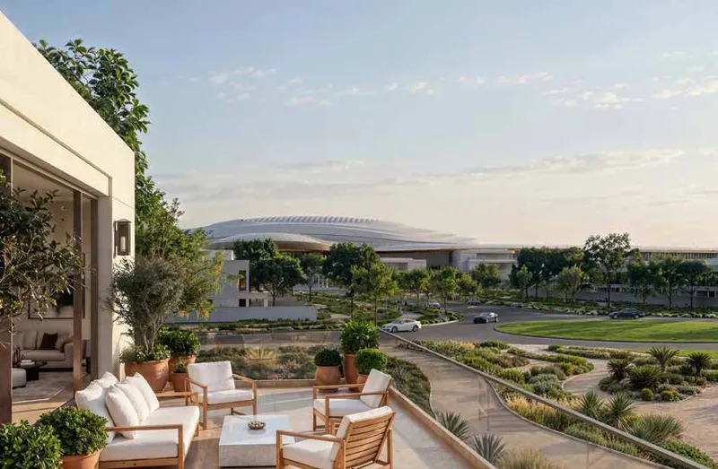 Wadeem Gardens terrace view toward the Hudayriyat Arena