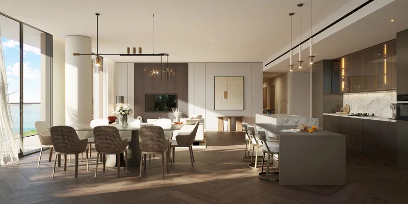 Render of an open-plan living, dining and kitchen area in a Waldorf Astoria Residences Yas apartment with floor-to-ceiling windows