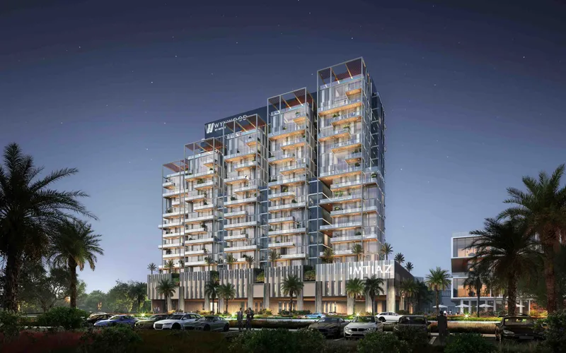 Wynwood by Imtiaz building lit at dusk