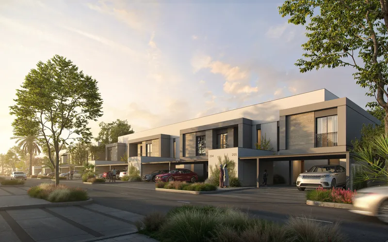 Render of a row of two-storey townhouses at The Orchids, Yas Acres, with covered parking and landscaped verges at sunset