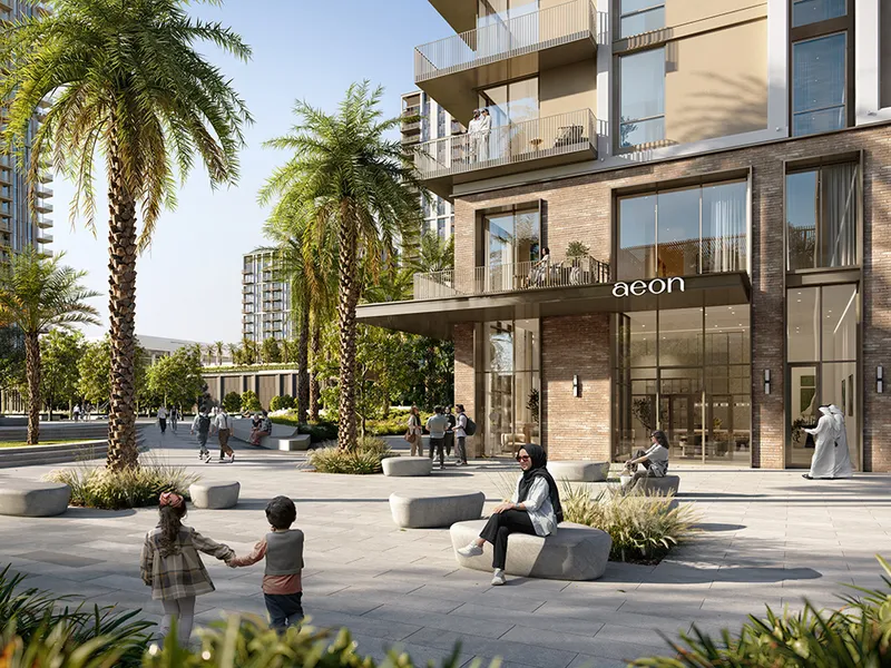 Render of the Aeon entrance with its sign, palm trees and a paved plaza